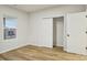 Bright bedroom with wood-look floors, large closet, and window at 1423 Roseland Dr, Lincolnton, NC 28092