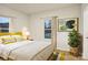 Cozy bedroom with yellow headboard and a large window at 1423 Roseland Dr, Lincolnton, NC 28092