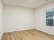 Spacious bedroom featuring light walls, wood-look floors, and a window with a view at 1423 Roseland Dr, Lincolnton, NC 28092
