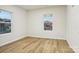 Well-lit bedroom with hardwood floors and ample natural light at 1423 Roseland Dr, Lincolnton, NC 28092