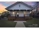 Charming craftsman style home with a front porch and landscaped yard at 1423 Roseland Dr, Lincolnton, NC 28092
