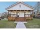 Charming house with a porch, wooden stairs, and landscaped lawn at 1423 Roseland Dr, Lincolnton, NC 28092