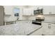 Modern kitchen with white cabinets and granite countertops at 1423 Roseland Dr, Lincolnton, NC 28092