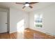 Well-lit bedroom featuring hardwood floors and a window at 1509 Redcoat Dr, Charlotte, NC 28211