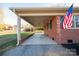 Covered porch with concrete flooring and brick columns at 1924 Lincolnton Hwy, Cherryville, NC 28021