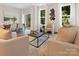 Bright living room featuring neutral decor and hardwood floors at 2105 Gemway Dr, Charlotte, NC 28216