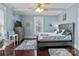 Bedroom with a queen-size bed, dresser, and hardwood floors at 215 W Eastway Dr, Charlotte, NC 28213