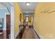 Bright hallway with decorative wall art and access to other rooms at 215 W Eastway Dr, Charlotte, NC 28213