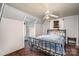 Small bedroom with metal bed frame and ceiling fan at 228 Sugar Loaf Dr, Troy, NC 27371