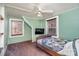 Cozy bedroom with two windows, carpet, and ceiling fan at 228 Sugar Loaf Dr, Troy, NC 27371