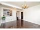 Bright dining room with hardwood floors and a unique chandelier at 228 Sugar Loaf Dr, Troy, NC 27371