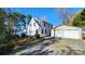House exterior with lake view and two-car garage at 228 Sugar Loaf Dr, Troy, NC 27371