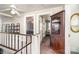 Upper hallway with built in shelving and antique cabinet at 228 Sugar Loaf Dr, Troy, NC 27371