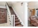 Traditional wooden staircase with ornate details at 228 Sugar Loaf Dr, Troy, NC 27371