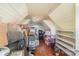 Unfinished attic with shelving and room for storage at 228 Sugar Loaf Dr, Troy, NC 27371