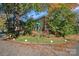 Brick home with autumn foliage, located on a tree-lined street at 2435 Calais Pl, Charlotte, NC 28211