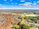 Aerial view of home and surrounding autumn foliage at 27311 Hedge Rd, Albemarle, NC 28001