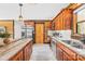 Kitchen features stainless steel appliances and custom wood cabinets at 27311 Hedge Rd, Albemarle, NC 28001