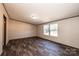 Spacious bedroom with wood-look floors and dual windows at 3553 33Rd Street Ne Dr, Hickory, NC 28601