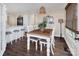 Charming dining room with a wooden table and lake view at 379 Alberta Dr, Norwood, NC 28128