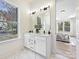 Elegant bathroom with double vanity, marble floors, and view of bedroom at 3837 Bon Rea Dr, Charlotte, NC 28226