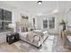 Spacious bedroom with plush bed, large windows, and hardwood floors at 3837 Bon Rea Dr, Charlotte, NC 28226