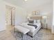 Serene bedroom with a queen-size bed and access to the hallway at 3837 Bon Rea Dr, Charlotte, NC 28226