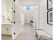 Bright entryway with hardwood floors, bench, and access to powder room at 3837 Bon Rea Dr, Charlotte, NC 28226