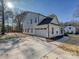Modern farmhouse exterior with white siding, two-car garage, and concrete driveway at 3837 Bon Rea Dr, Charlotte, NC 28226