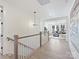 Open hallway with hardwood floors, staircase, and views to living area at 3837 Bon Rea Dr, Charlotte, NC 28226