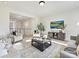Spacious living room with plush seating, hardwood floors, and views to upper hallway at 3837 Bon Rea Dr, Charlotte, NC 28226