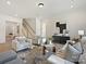 Spacious living room with light-colored sofas and a large area rug at 3837 Bon Rea Dr, Charlotte, NC 28226