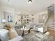 Bright and airy living room with hardwood floors and a view into the kitchen at 3837 Bon Rea Dr, Charlotte, NC 28226