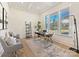 Home office with hardwood floors, built-in shelving and plenty of natural light at 3837 Bon Rea Dr, Charlotte, NC 28226