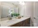 Double vanity bathroom with modern finishes and a large mirror at 4003 Bourne Ct # Lot 41, Charlotte, NC 28262