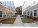 Neatly landscaped community courtyard with a walkway between townhomes at 4003 Bourne Ct # Lot 41, Charlotte, NC 28262