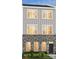 Stunning 3-story townhome with gray siding and brick at 4003 Bourne Ct # Lot 41, Charlotte, NC 28262