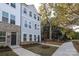 Townhouse exterior with gray siding and landscaping at 4003 Bourne Ct, Charlotte, NC 28262