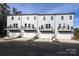 Four townhomes with attached garages and balconies at 4003 Bourne Ct # Lot 41, Charlotte, NC 28262