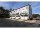 Four townhomes showcasing attached garages and balconies at 4003 Bourne Ct # Lot 41, Charlotte, NC 28262