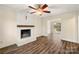 Living room with fireplace, wood floors, and access to a deck at 4378 Eastridge Dr, Gastonia, NC 28056