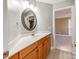 Bathroom with vanity, mirror, and access to another bedroom at 4509 Long Cove Dr, Denver, NC 28037