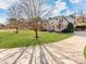 Brick house with a circular driveway and large yard at 4509 Long Cove Dr, Denver, NC 28037