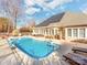 Relaxing pool area with solar panels on the house at 4509 Long Cove Dr, Denver, NC 28037