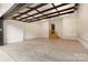 Spacious garage with concrete floor and overhead door at 504 Mcalway Rd, Charlotte, NC 28211