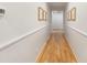 Bright hallway with wood floors and white wainscoting at 504 Mcalway Rd, Charlotte, NC 28211