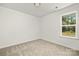 Spacious bedroom with neutral wall and carpet, and a window at 6316 Linda Vista Ln, Charlotte, NC 28216