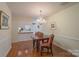 Elegant dining room with hardwood floors and chandelier at 7507 Hurstbourne Green Dr, Charlotte, NC 28277