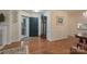 Bright and airy entryway with hardwood floors and coat closet at 7507 Hurstbourne Green Dr, Charlotte, NC 28277