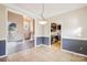 Dining room with tile floor, two-tone walls, and views into living room and kitchen at 8325 Springhead Ln # 48, Charlotte, NC 28215